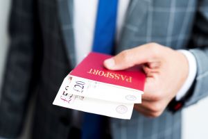 A man presents cash inside a passport.